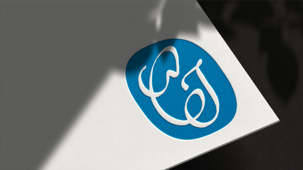 Cerulean monogram embossed on paper
